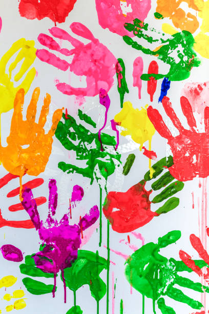 istock Colorful painted hand prints on white background 1223657112