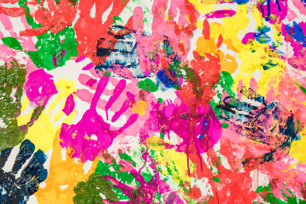istock Colorful painted hand prints on white background 1223657180