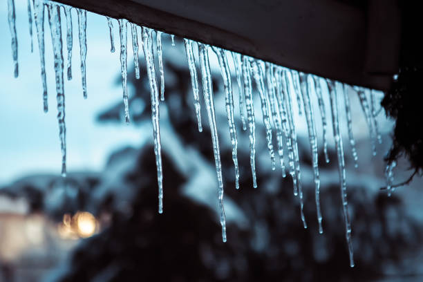 istock icicles hanging from the roof in cold weather 1223657418