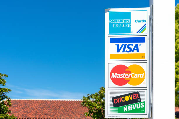 American Express, MasterCard, VISA, Discover payment options sign American Express, MasterCard, VISA, Discover payment options advertised on the outdoor sign near business location - San Jose, California, USA - 2020 american express stock pictures, royalty-free photos & images