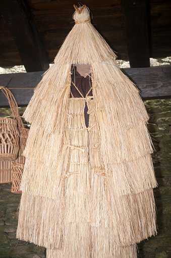 Coroza, historical traditional craft reed cloak to protect farmers from rain in Galicia, Spain.