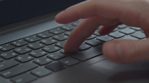 istock A man is typing on a laptop. Extreme close-up 1223660962