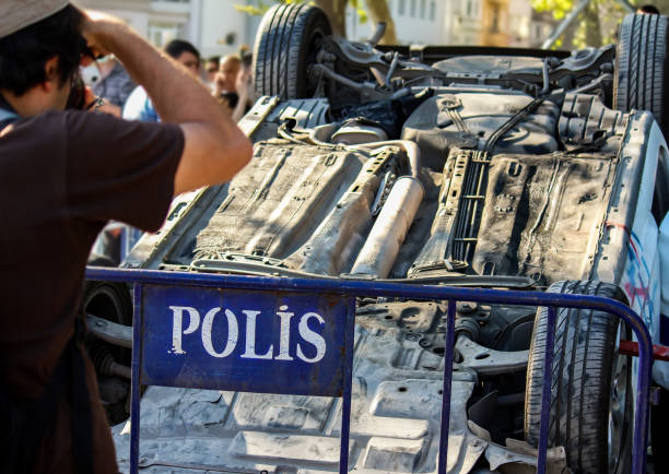 a police car crash incident, went upside down, completely ruined during the protests of Gezi Park in Istanbul Taksim a police car crash incident, went upside down, completely ruined during the protests of Gezi Park in Istanbul Taksim riot police stock pictures, royalty-free photos & images