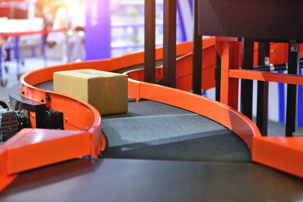 istock Cardboard Boxes on Conveyor Belt at Logistics Warehouse 1223663253
