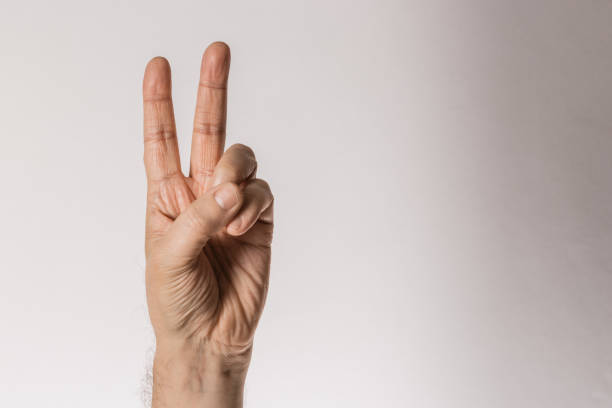 istock Man`s hand gesture, counting number two, isolated on white background - part of set 1223664670