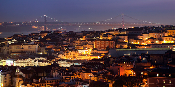 Galata tower and Istanbul cityscape at sunset with crescent moon