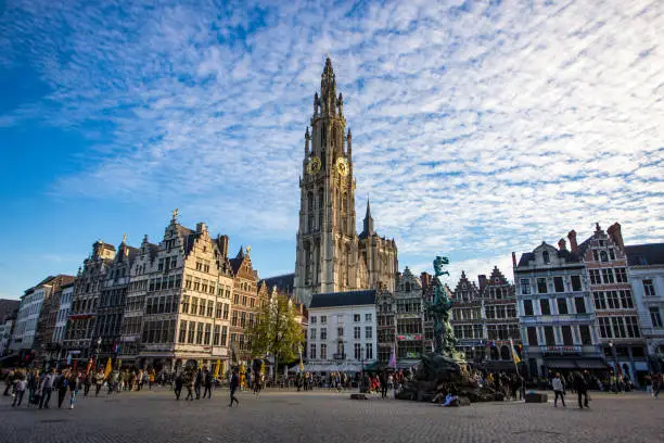 Brabo's Monument (Brabomonument) and The Cathedral of Our Lady in Antwerp, Belgium.