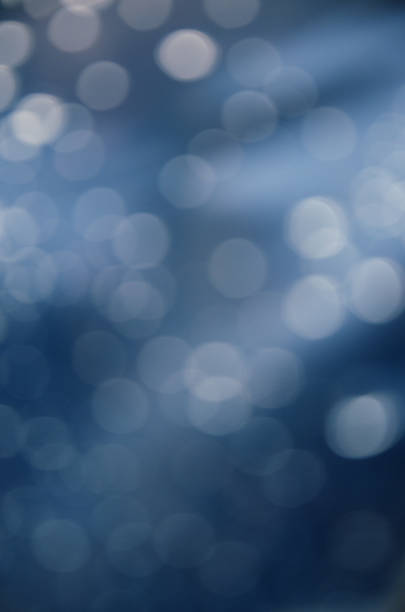 istock Abstract blurred blue background with circles of lense bokeh. 1223666455