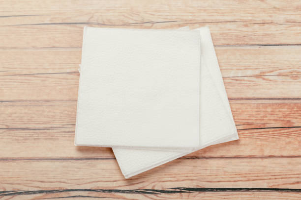 istock white paper napkin or tissue on the wooden table background. 1223666470