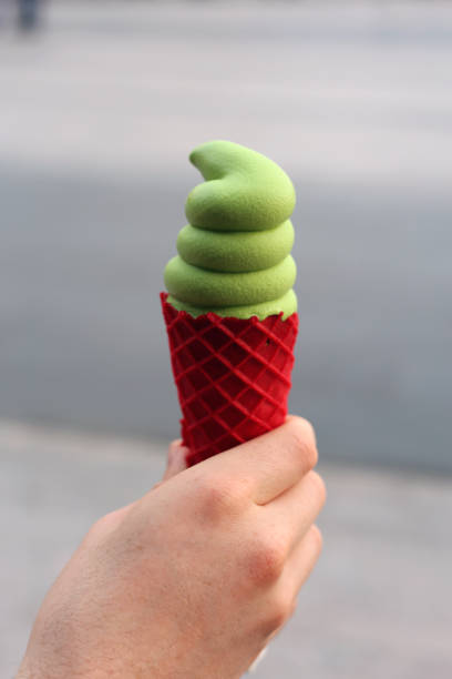 istock Green Pistachio Ice Cream and Red Raspberry Flavored Waffle Cone 1223671407