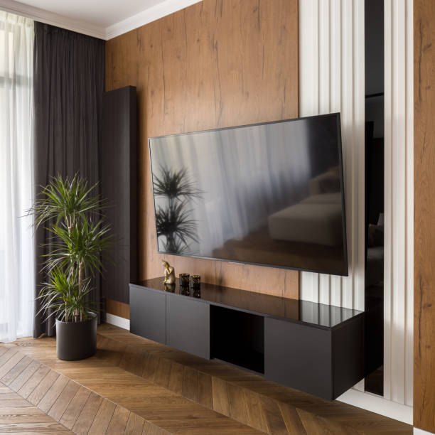 istock Big tv screen in living room 1223674063