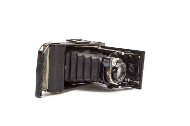 istock Old photo camera isolated on white background 1223674298