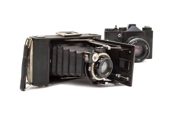 istock Two olld photo camera isolated on white background. Selective focus 1223674308