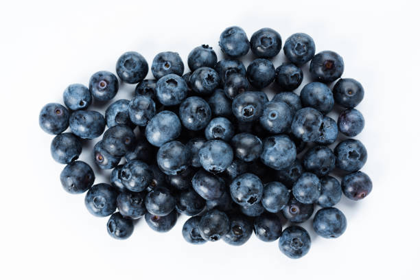 istock A group of fresh blue berries close-up, isolated on a white background. 1223674671