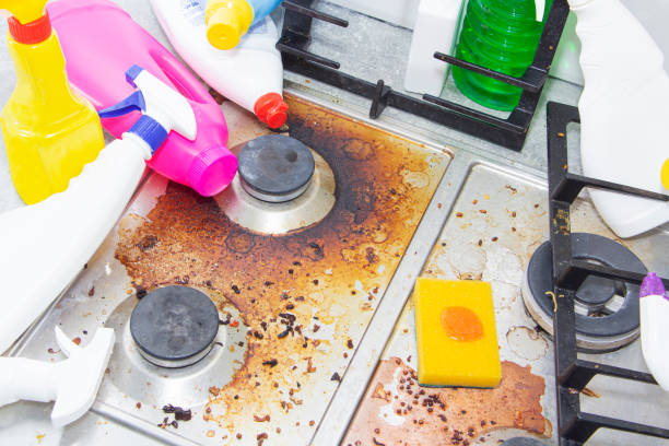 istock dirty kitchen stove, empty and full bottles of detergents around. 1223675552