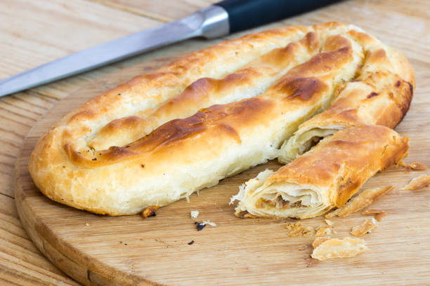 istock Sliced burek with meat on the wooden board. Rustic food. 1223675667