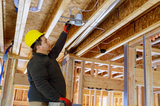 istock Installing a spotlight in the room on wooden beamed ceiling 1223675966