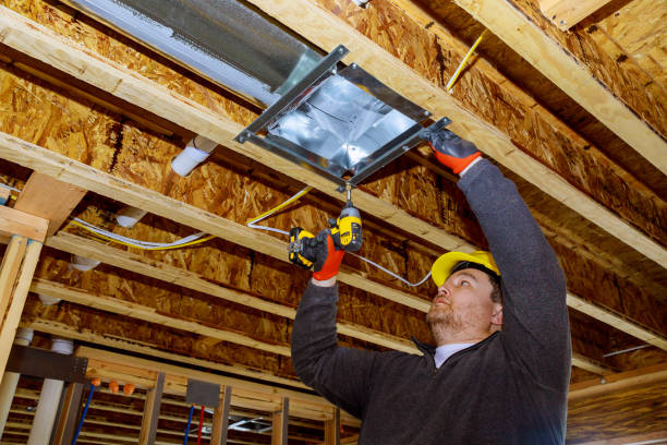 Male technician mounted air conditioner on ceiling ventilation s Male technician mounted air heating and cooling system on ceiling steel roof structure ventilation system wall mounted air conditioner stock pictures, royalty-free photos & images