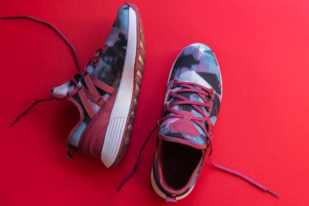 istock Sneakers on the red background 1223676743
