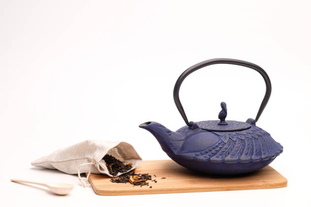 istock Blue metal cast-iron teapot on a white background. 1223678394