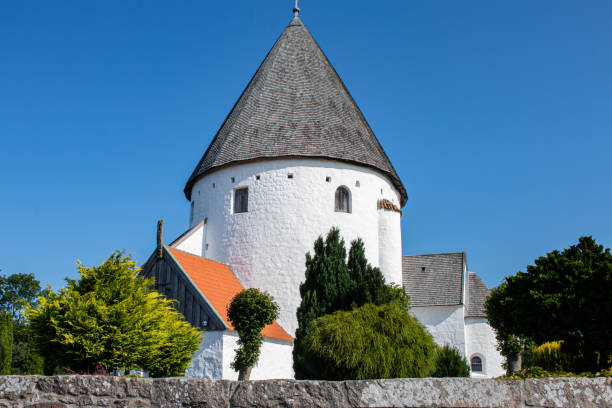 istock Round church on Bornholm with blue sky 1223678811