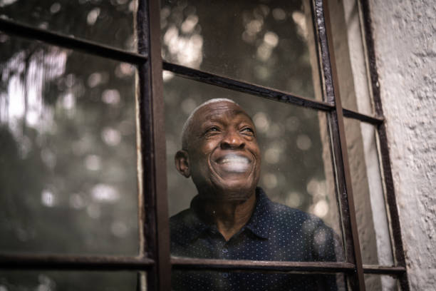 istock Senior man looking away from his window 1223682342