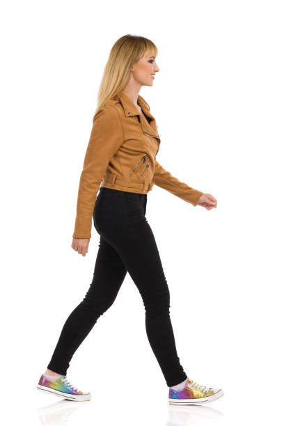 istock Young Woman Is Walking. Side View. 1223682433