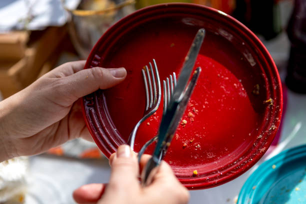 dirty colored plates with forks and grill pan