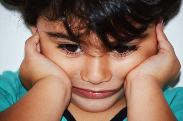 istock Upset kid complains about her stomachache 1223687363