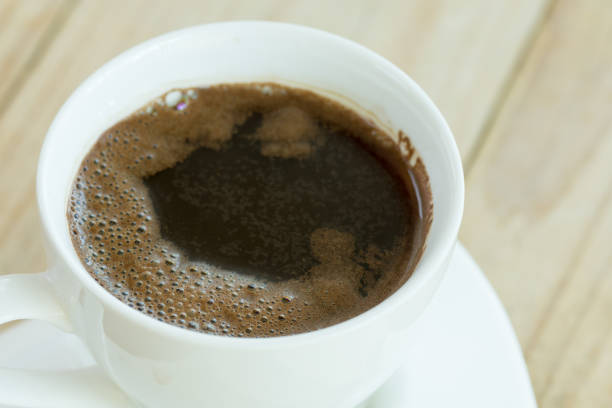 istock Closeup macro view cup of black coffee 1223688342