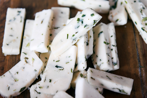 White cheese with herb on the wood