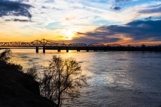 Sunset landscape of the Mississippi River bridge between Mississippi and Louisiana, in Vicksburg, MS.