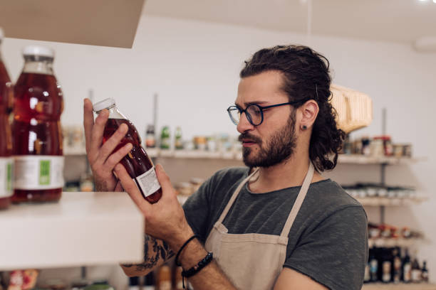 istock Young salesman working at the grocery store 1223692241