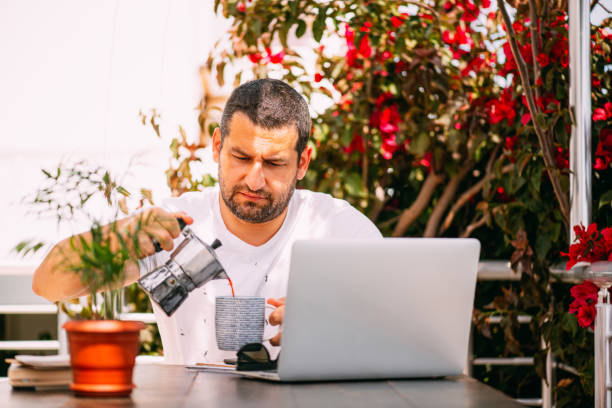 istock Man Drinking Coffee With Moka Pot 1223693409