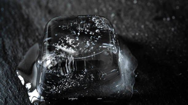 istock melting ice cubes on black background 1223693509