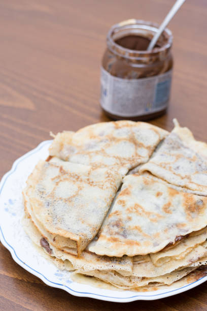 istock Fried pancakes with chocolate cream served on the plate 1223693788