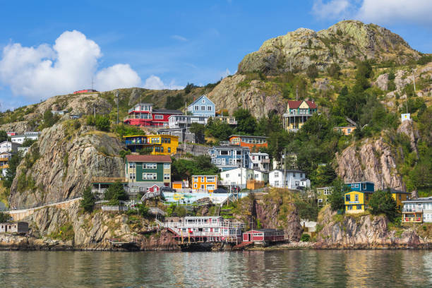 'The Battery' a neighbourhood in St. John's, Newfoundland, Canada, seen from across St. John's Harbour in the summer 'The Battery' a neighbourhood in St. John's, Newfoundland, Canada, seen from across St. John's Harbour in the summer. st. johns newfoundland photos stock pictures, royalty-free photos & images