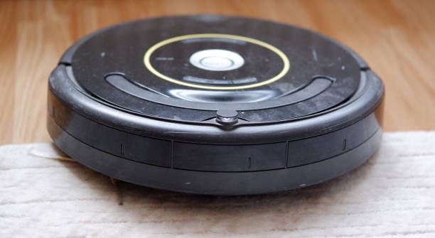 istock robotic vacuum cleaner on carpet smart cleaning technology 1223695954