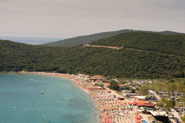 istock Aerial view sunny sea beach with parasols 1223695968