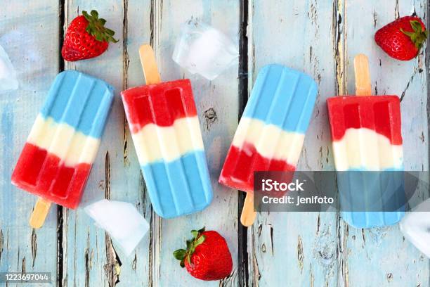 Red White And Blue Summer Fruit Ice Pops On Rustic Blue Wood Stock Photo - Download Image Now