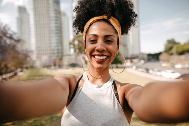istock Woman having fun taking selfie 1223698760