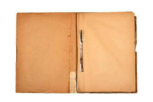front view closeup of old open file document folder with aged light brown empty pages cardboard covers and rusted metallic binding isolated on white background
