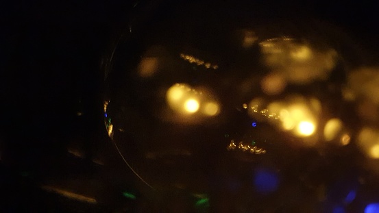 Crystal ball illuminated with different colours