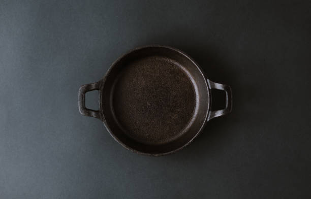 istock Empty black metal plate on a black background. 1223704318