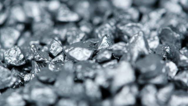 Heap of silver nuggets background (seamless loopable)