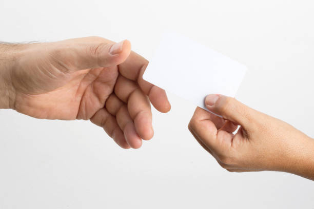 istock Lady extends white blank business card 1223706377