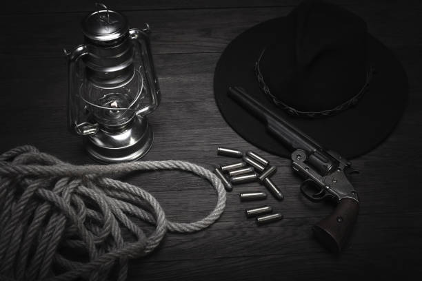 istock Old western cold blast lantern and revolver with cartridges 1223707468