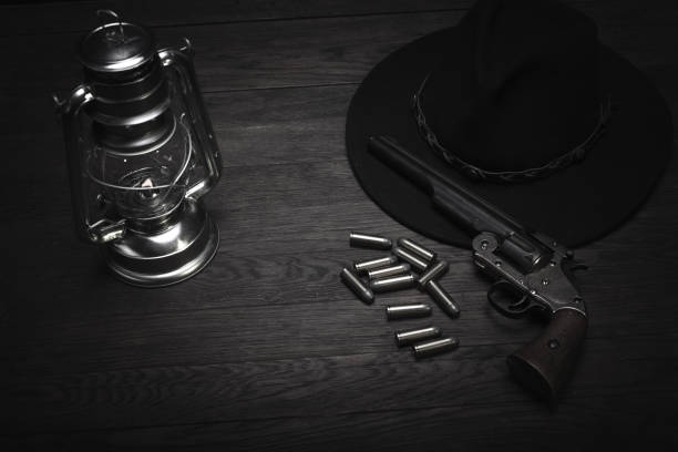 istock Old western cold blast lantern and revolver with cartridges 1223707474