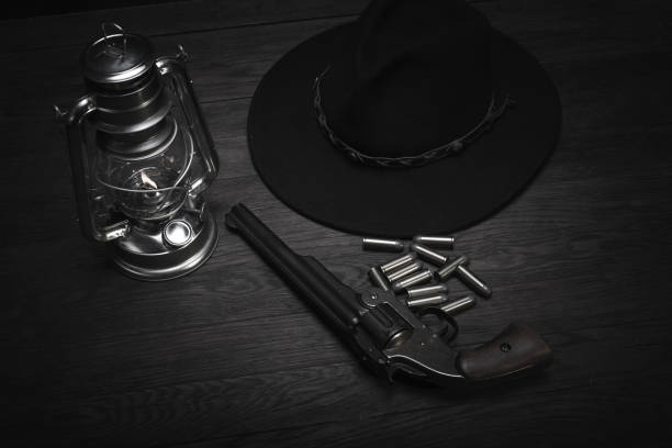 istock Old western cold blast lantern and revolver with cartridges 1223707482