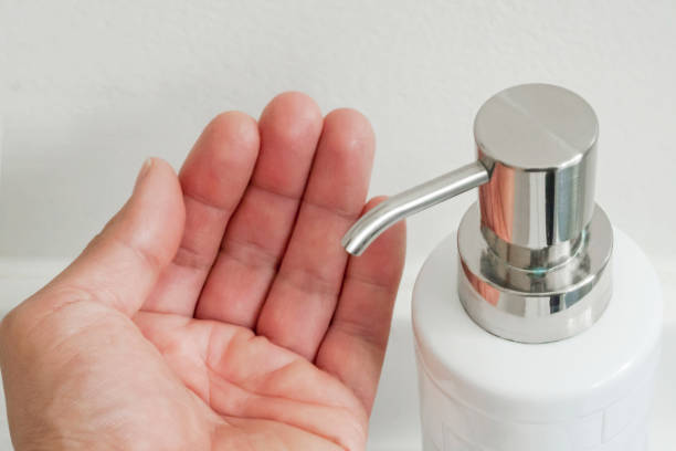 istock washing hands with soap and dispenser 1223708025